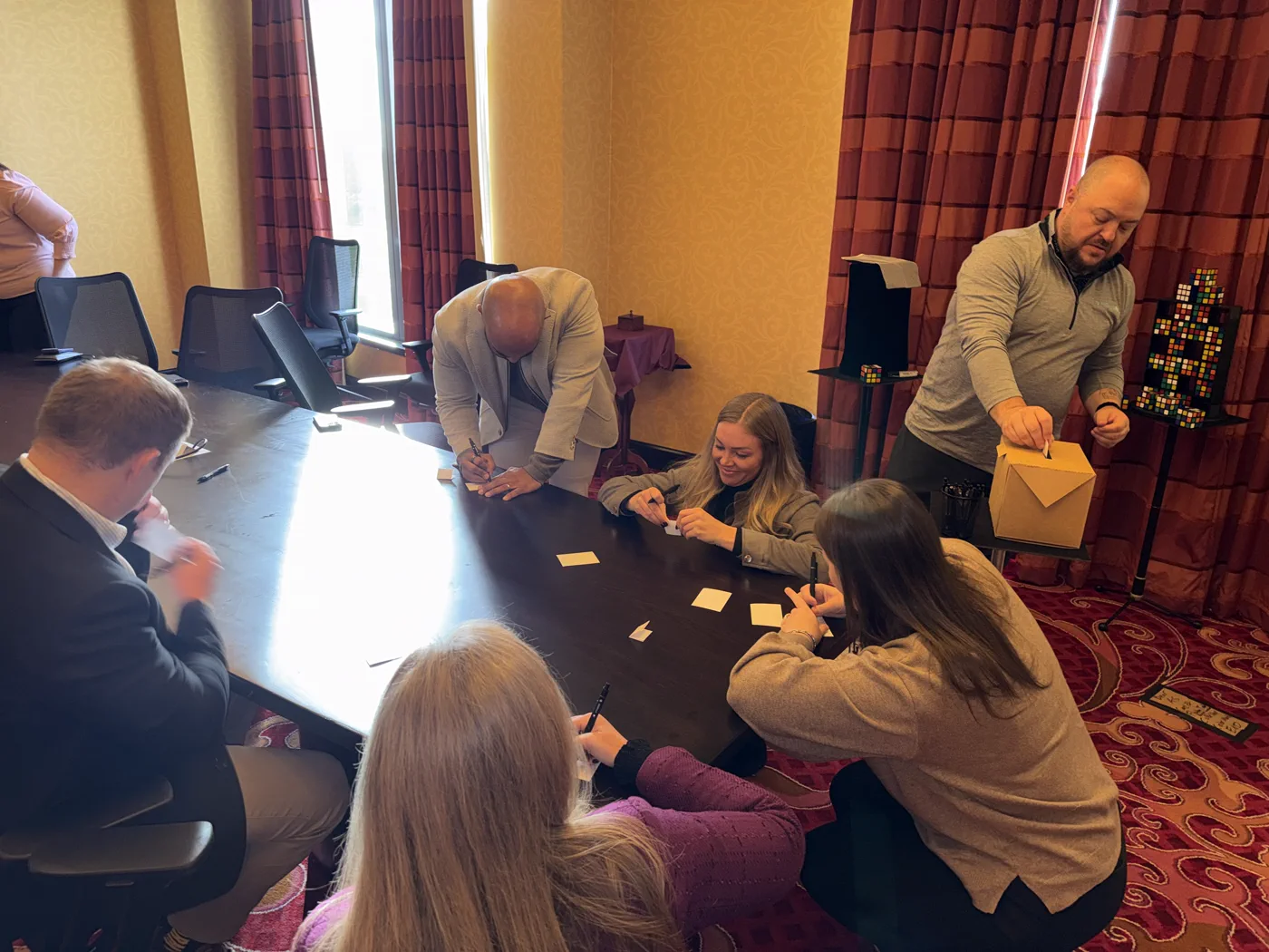 Team members writing their answers during the Versus RX show